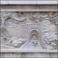 Stone relief depicting daily life in old Chongqing, including a water carrier climbing steps toward a city gate