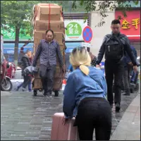 The city still relies heavily on people transporting all kinds of goods on foot.