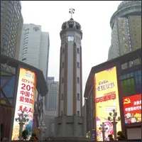 Liberation Monument rising above a busy commercial area in central Chongqing