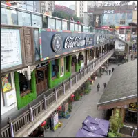 Multi-level stilt building complex of Hongyadong in Chongqing with shops and restaurants along the hillside
