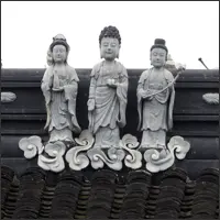 Three decorative figures on a temple roof at Hanshan Temple
