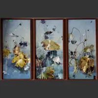 A three-panel Xiang embroidery depicts an autumn lotus pond with fading gold, green and blue leaves, bare curving stems and seedpods.