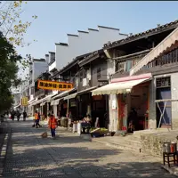 Traditional two-storey buildings, shops and restaurants line a quiet street in Jinggang Ancient Town.