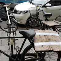 Bicycle waiting to be loaded with goods parked beside a street in Guangzhou.